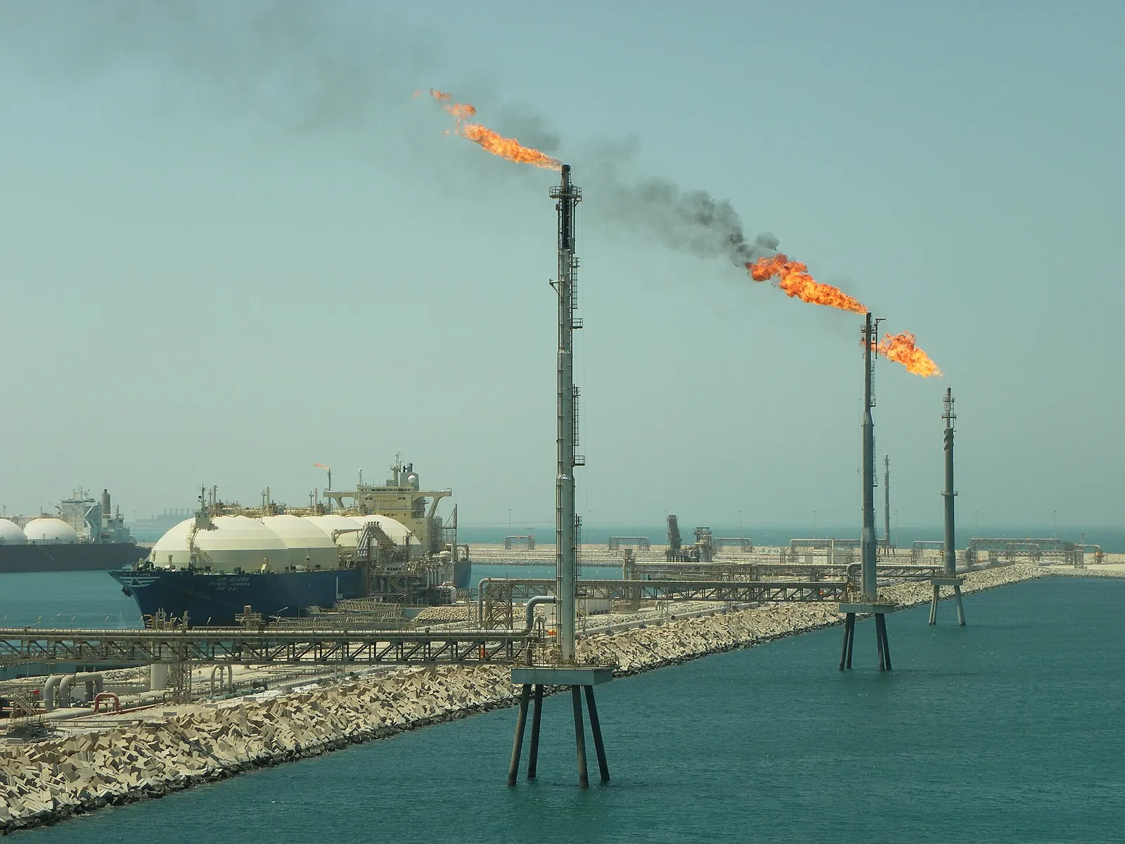 Flares and an LNG carrier at the Ras Laffan LNG terminal, Qatar
